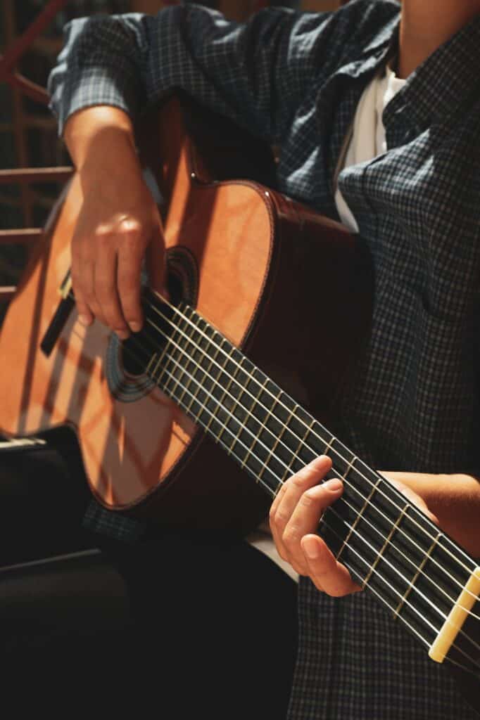 Artist playing guitar who gets support and management from Good Company Entertainment Group in Edmonton