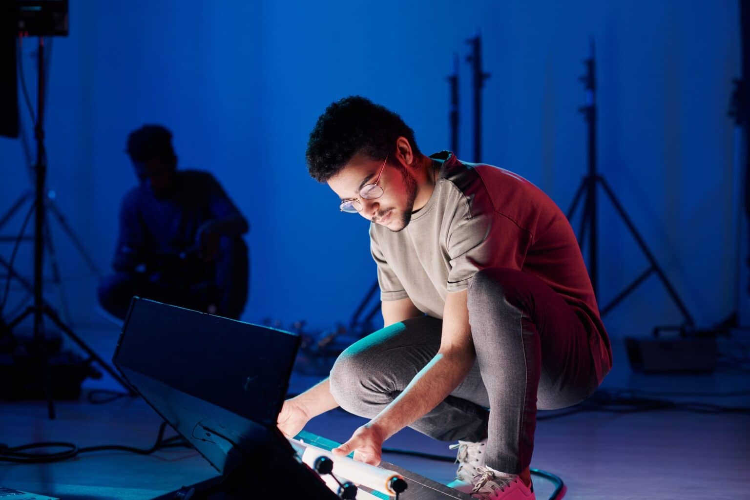 Man setting the light for show hosted by Good Company Entertainment Group including the audio and visual production