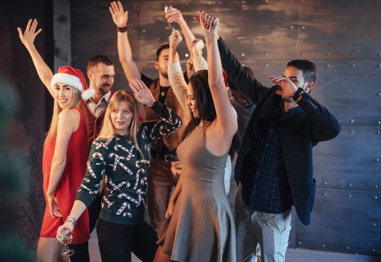 Group of people dancing at Christmas party with event DJ services provided by Good Company Entertainment Group in Edmonton
